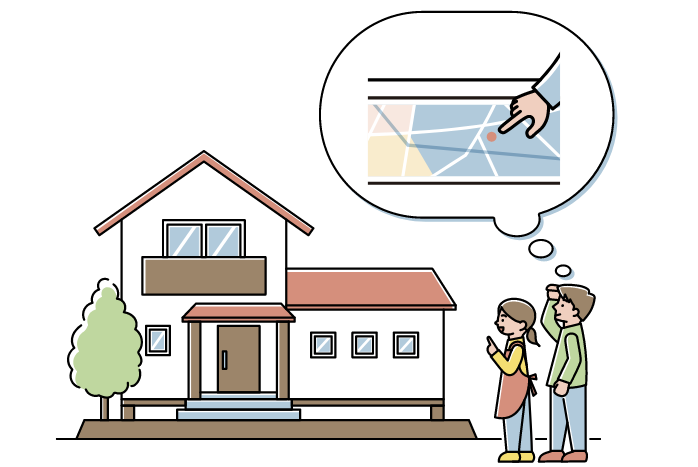 住宅を見ながらハザードマップ上の位置を思い浮かべている住民